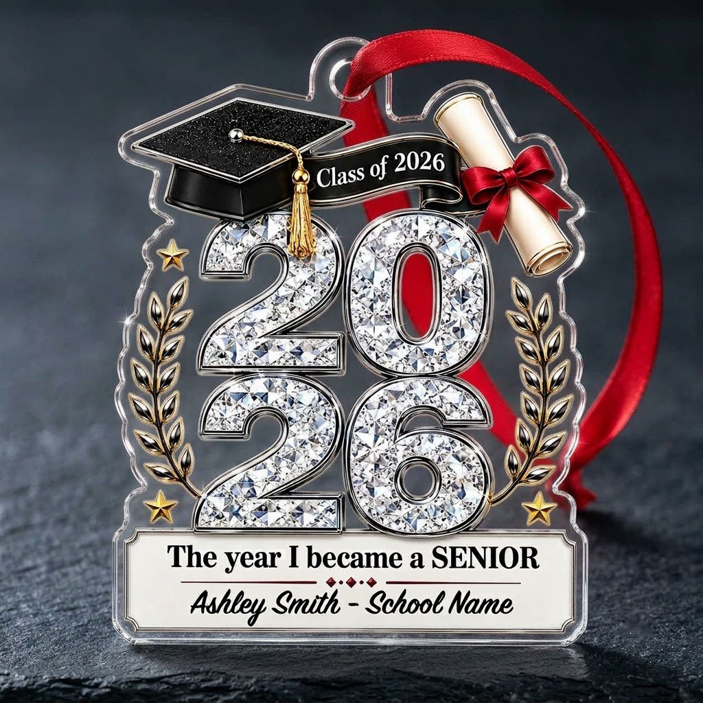 Custom-cut clear acrylic ornament shaped like a graduation cap with Class of 2026, diploma, laurels, and name plaque.