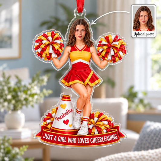 Custom-cut acrylic ornament of a cheerleader in red and yellow with pom-poms, a white megaphone, and a red name banner
