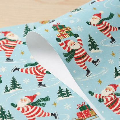 Blue wrapping paper with a pattern of ice-skating Santas, pine trees, sleds of gifts, presents and golden stars.