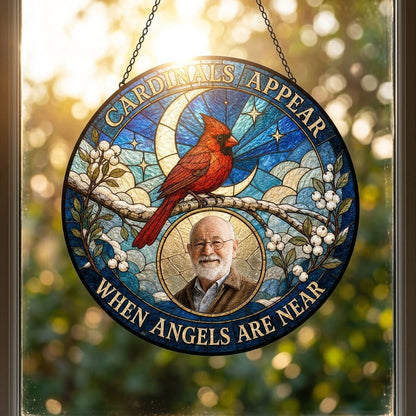 Round stained-glass style suncatcher with a red cardinal, starry blue sky, crescent moon, and a circular frame with a pe