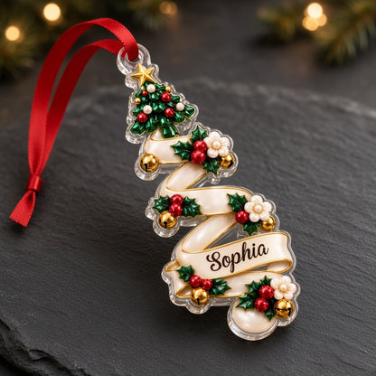 Acrylic ornament shaped around two green gem-style Christmas trees with holly, berries and names Oliver and Emma.