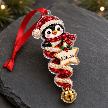 Acrylic angel and gingerbread ornaments with jeweled ribbons, heart or star name banners, and gold bells.