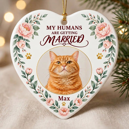 Heart ceramic ornament with 'My Humans Are Getting Married,' a cat photo, pink florals, gold paw prints, and a heart ico