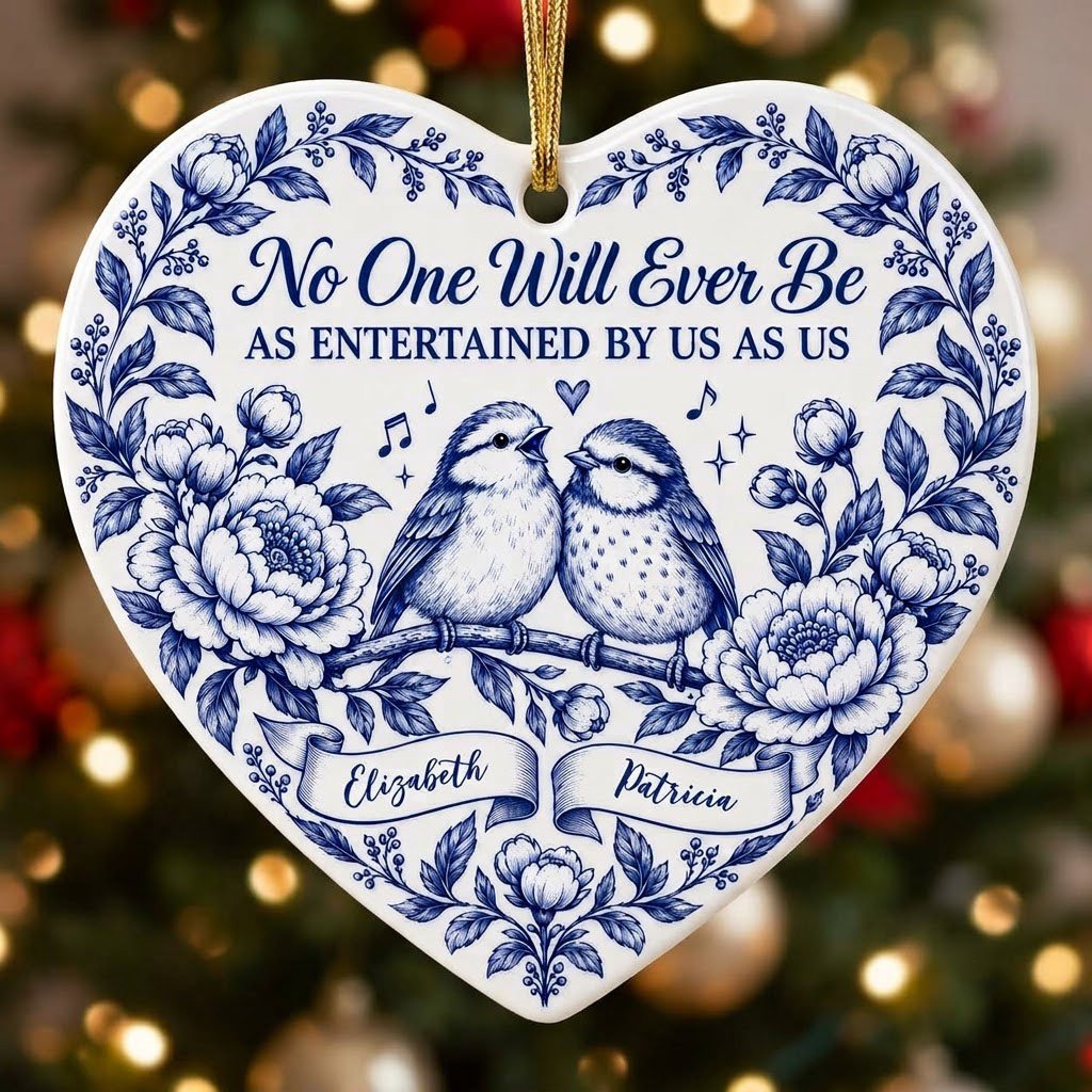 Heart ceramic ornament with two birds, blue floral frame, music notes above, and two name banners in cobalt.