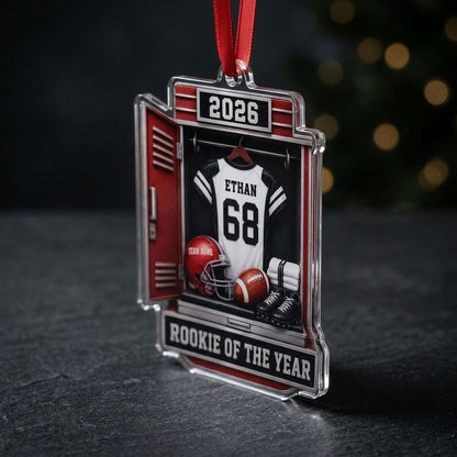 Acrylic ornament shaped like a football locker with jersey, red helmet, ball, towels and ROOKIE OF THE YEAR banner.