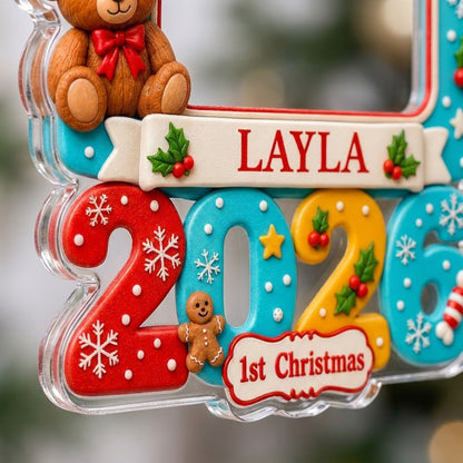 Light blue gift-box photo ornament with cream bow, teddy bear, red trim, and colorful 2026 base with 1st Christmas.