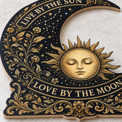 Crescent moon and sleeping sun wooden sign with gold constellations and words Live by the Sun, Love by the Moon.