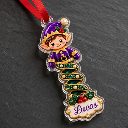 Clear acrylic ornament with a cartoon elf or Mrs. Claus, spiral ribbon body, holly, and a white name scroll.