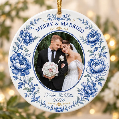 Round ceramic ornament with blue chinoiserie border, gold accents, and a circular wedding photo framed at center.