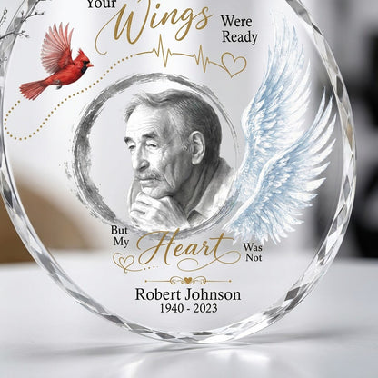 Round glass ornament with a sketch portrait frame, blue angel wing, red cardinal and 'Your Wings Were Ready' memorial te
