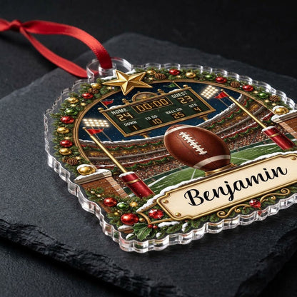 Acrylic ornament with football on a tee, stadium scoreboard, and pine garland border with a name banner.
