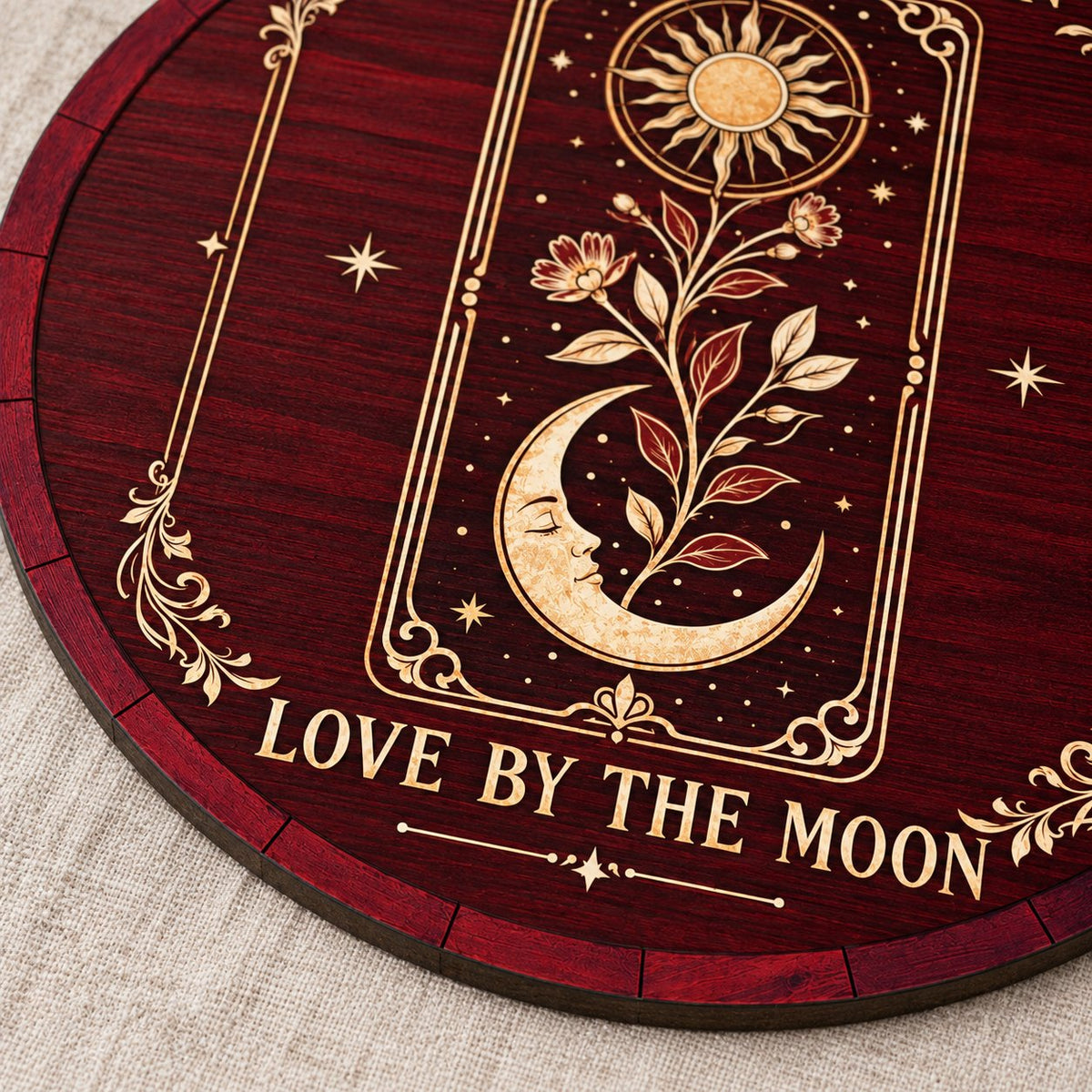 Round wooden sign with tarot-style sun and sleeping moon, floral vine, stars, and the words Live by the Sun, Love by the