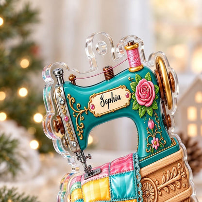 Custom-cut acrylic ornament of a teal vintage sewing machine with a rose and quilt block, personalized with a name.