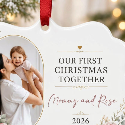 White scalloped ceramic ornament with gold oval photo frame, pink peonies, and Our First Christmas Together text.