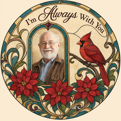 Round stained-glass style suncatcher with arched photo window, red cardinal, three red poinsettias and the words I'm Alw