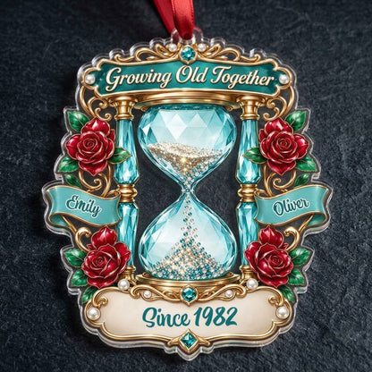 Custom-cut acrylic ornament with jeweled hourglass, red roses, and the words 'Growing Old Together'.
