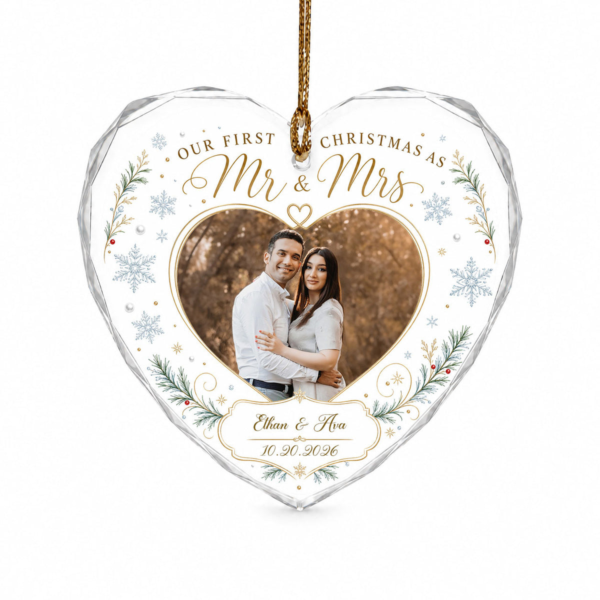 Heart-shaped glass ornament with couple photo, 'Our First Christmas As Mr & Mrs', pine sprigs, berries and gold snowflak