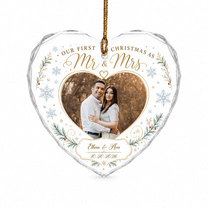 Heart-shaped glass ornament with couple photo, 'Our First Christmas As Mr & Mrs', pine sprigs, berries and gold snowflak