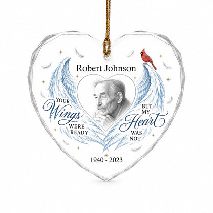 Heart-shaped glass ornament with blue angel wings, red cardinal, and a memorial quote with name and years.