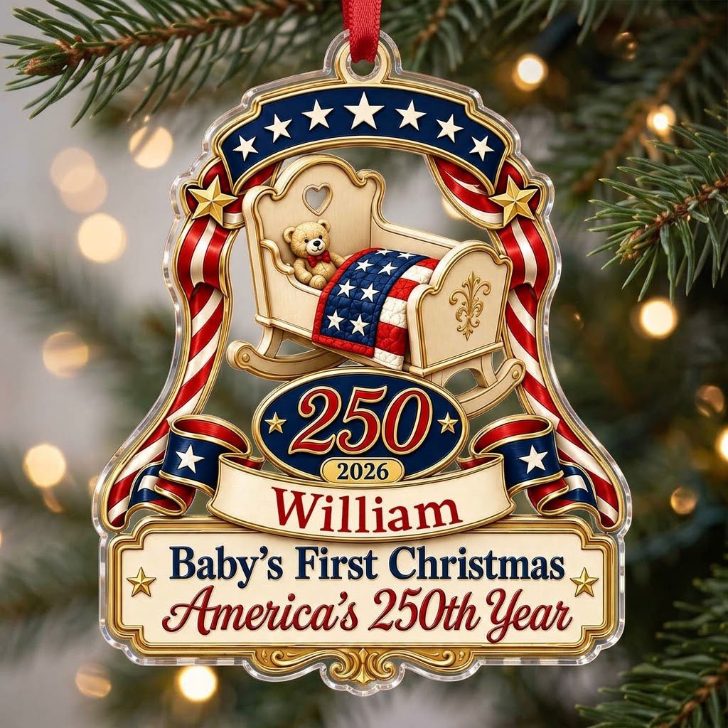 Acrylic ornament with baby crib, teddy bear, patriotic ribbon, and 'Baby's First Christmas', personalized with name and 
