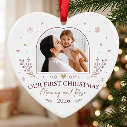 Heart ceramic ornament with “OUR FIRST CHRISTMAS”, arch photo frame, stars, snowflakes, berry sprigs, leafy flourishes, 