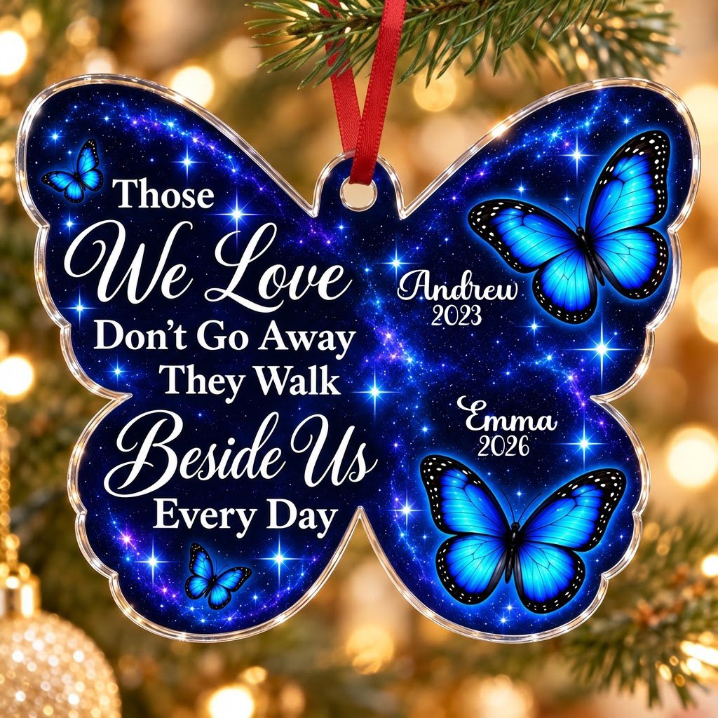 Butterfly-shaped ornament with blue butterflies and a galaxy background, reading Those We Love Don't Go Away.