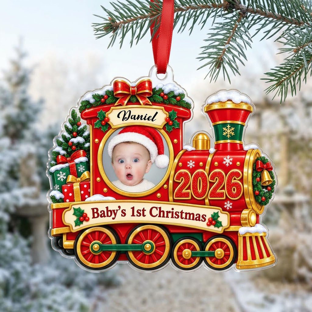 Red and gold train ornament with circular baby photo, bow, holly, wreath and 'Baby's 1st Christmas' on a scroll banner.