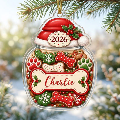 Custom-cut acrylic ornament shaped like a cookie jar with Santa hat, dog bone name plaque, and 2026 year badge.
