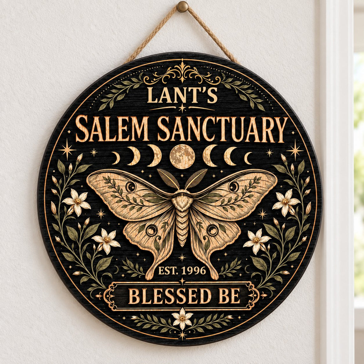Round wooden sign with a central moth, moon phases, floral vines, stars, and 'Salem Sanctuary' 'Blessed Be' text.