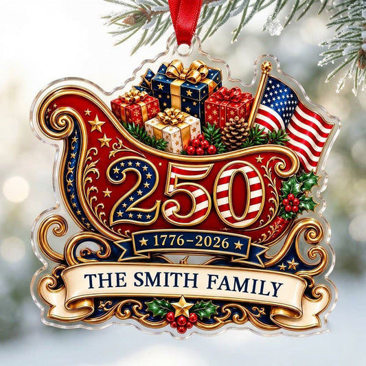 Acrylic ornament shaped like a Santa sleigh with '250', '1776-2026', US flag and a family name banner.