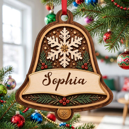 Personalized wooden bell ornament with snowflake, pine sprigs, red berries, and a name on the center banner.