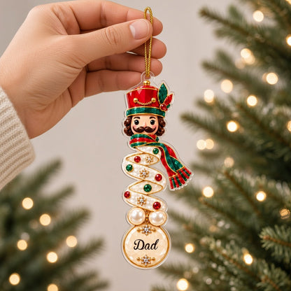 Clear acrylic ornament with a teddy bear or penguin in gem-detailed spiral style, personalized with names.