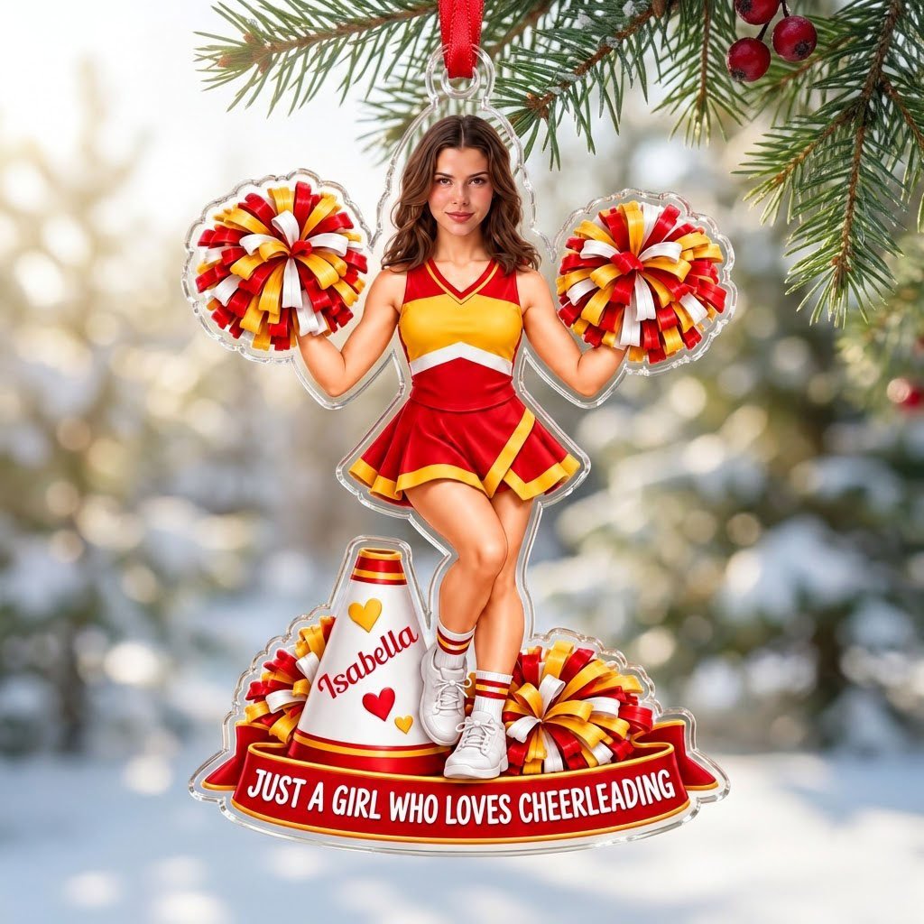 Custom-cut acrylic ornament of a cheerleader in red and yellow with pom-poms, a white megaphone, and a red name banner