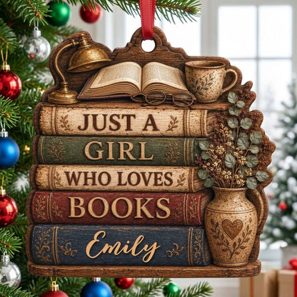 Bookshelf-shaped wood ornament with lamp, open book, teacup, vase, and Just a Girl Who Loves Books text.
