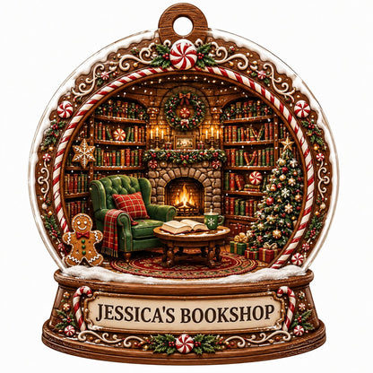 Snow globe ornament with candy-cane frame, cozy book-filled library, fireplace, tree, and 'JESSICA'S BOOKSHOP' nameplate
