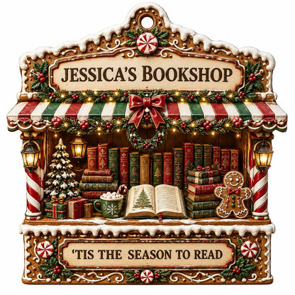 Gingerbread bookstore facade ornament with striped awning, wreath, books, lanterns, and 'TIS THE SEASON TO READ' text.