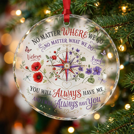 Round glass ornament with a compass rose, red and purple flowers, butterflies, dragonflies, and long-distance quotes.