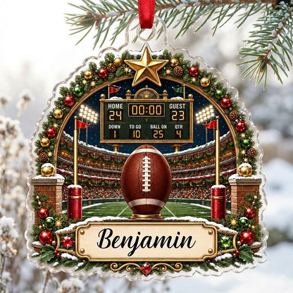 Acrylic ornament with football on a tee, stadium scoreboard, and pine garland border with a name banner.