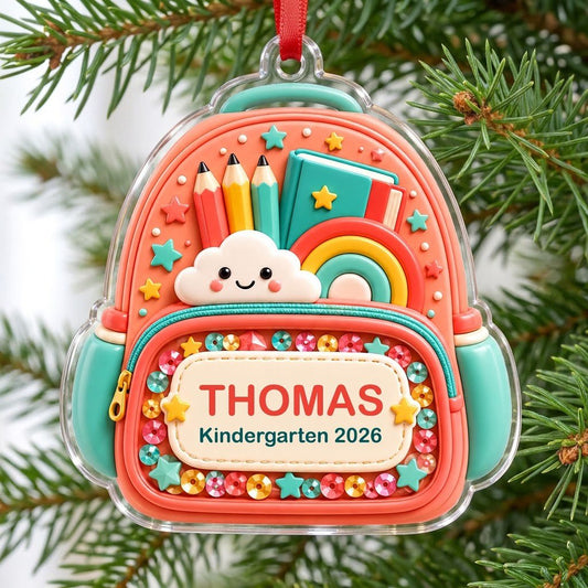 Coral backpack acrylic ornament with pencils, rainbow, smiling cloud, and 'THOMAS' Kindergarten 2026.