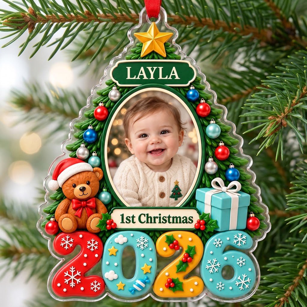 Green Christmas tree acrylic ornament with star topper, baby photo frame, teddy bear, and 2026 numbers.