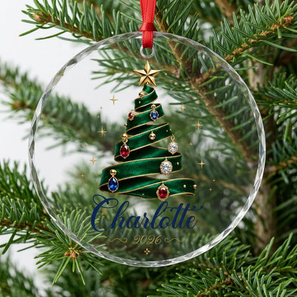 Round glass ornament with emerald ribbon tree, gold star and gem ornaments, personalized with name and year.