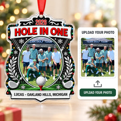 Acrylic crest ornament with golf photo, crossed clubs, Christmas lights, snowflakes, and HOLE IN ONE 2026 text.
