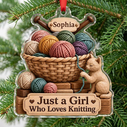 Acrylic ornament shaped around a yarn basket, cat and needles with 'Just a Girl Who Loves Knitting' and a name banner.