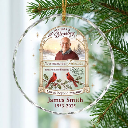 Round glass ornament with golden arched photo frame, two red cardinals on snowy pine and a memorial quote.