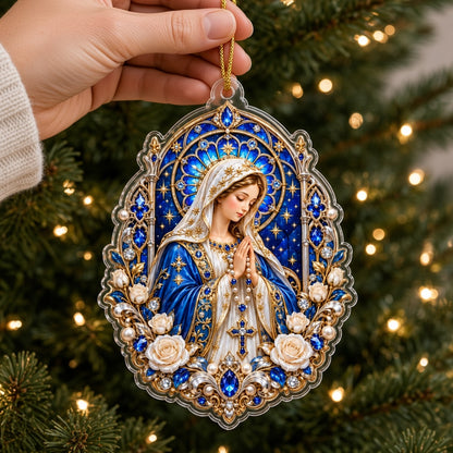 A custom-cut acrylic ornament of the Virgin Mary praying with a rosary, blue mantle, and ornate gold frame.