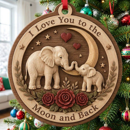 Round wood ornament with adult and baby elephants touching trunks under a crescent moon, red hearts, stars, and roses