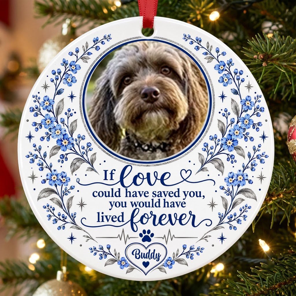 Round ceramic ornament with pet photo, blue forget-me-not florals, paw heartbeat line, and memorial quote.