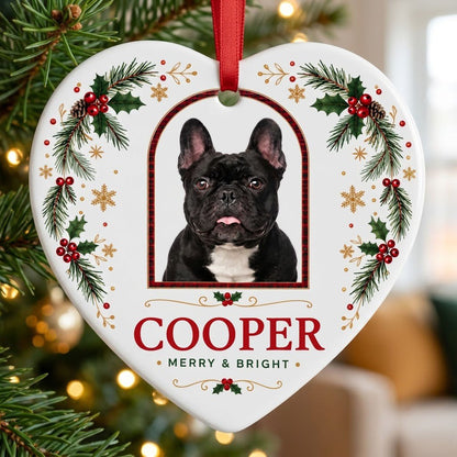 Heart ceramic ornament with dog photo in red-green plaid arch, holly, pine, gold snowflakes, and MERRY & BRIGHT text.