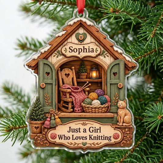 House-shaped acrylic ornament with cozy knitting shed scene and 'Just a Girl Who Loves Knitting' text.