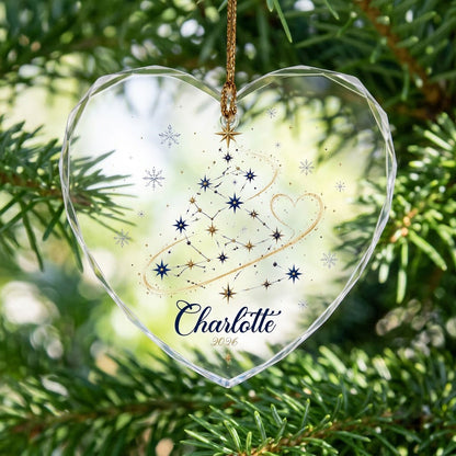 Heart-shaped stained glass suncatcher with a starry Christmas tree, gold ribbon heart, and snowflakes.